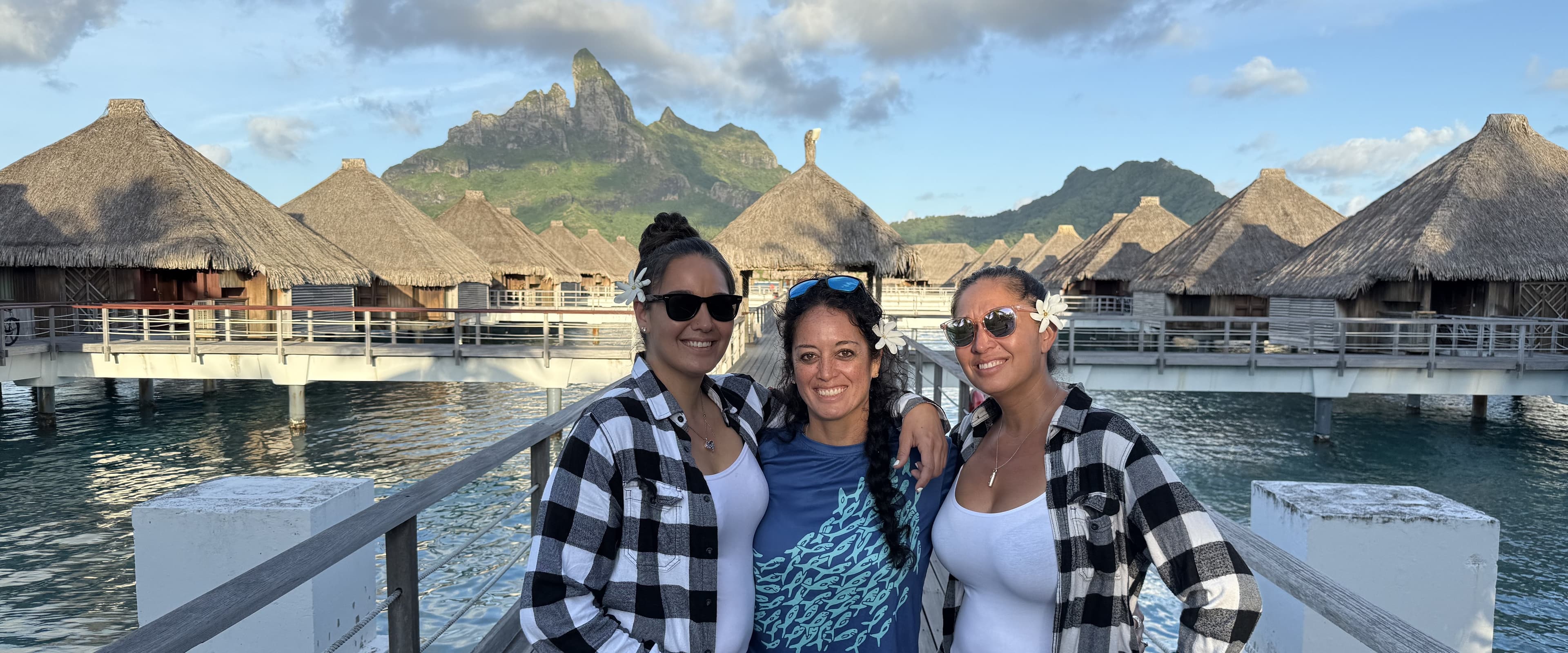 Tatiana and her sisters in Bora Bora, with Mount Otemanu behind