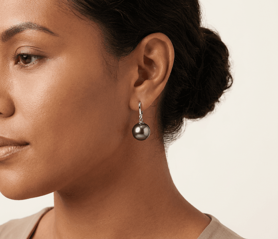 Tahitian pearl drop earrings on a model